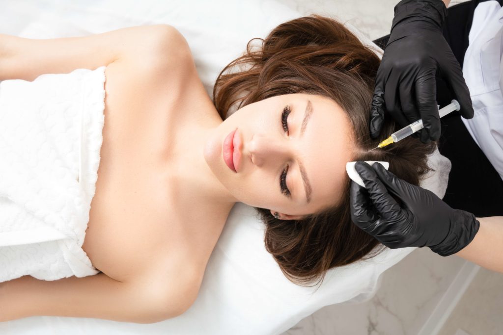 Beautiful Woman getting Injection on Scalp | Get Hair Restoration at Arabella Medical Aesthetics in Knoxville, TN