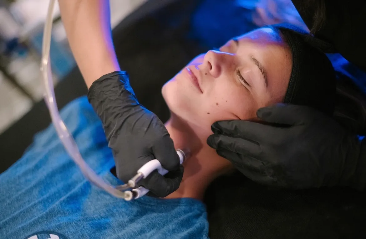 Woman with eyes closed receiving Diamond Glow Treatment | Arabella Medical Aesthetics | Knoxville, TX