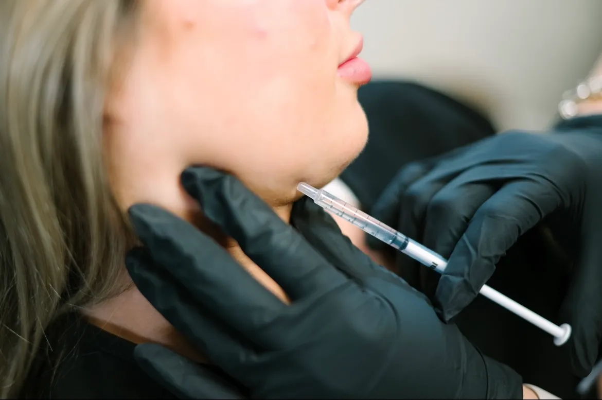 Girl getting injected for sculpted jawline | Arabella Medical Aesthetics | Knoxville, TX